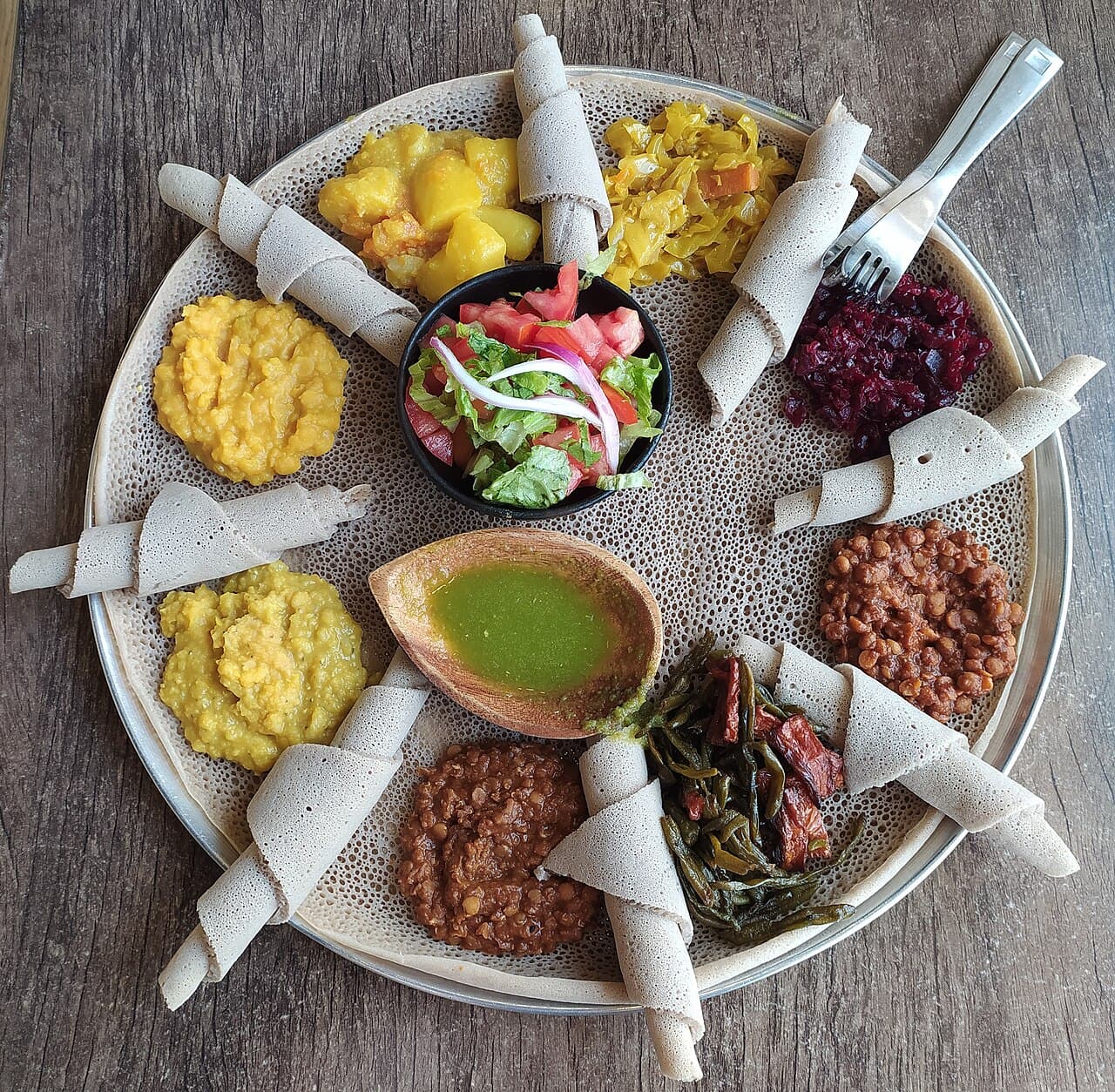 Injera served with an assortment of stews